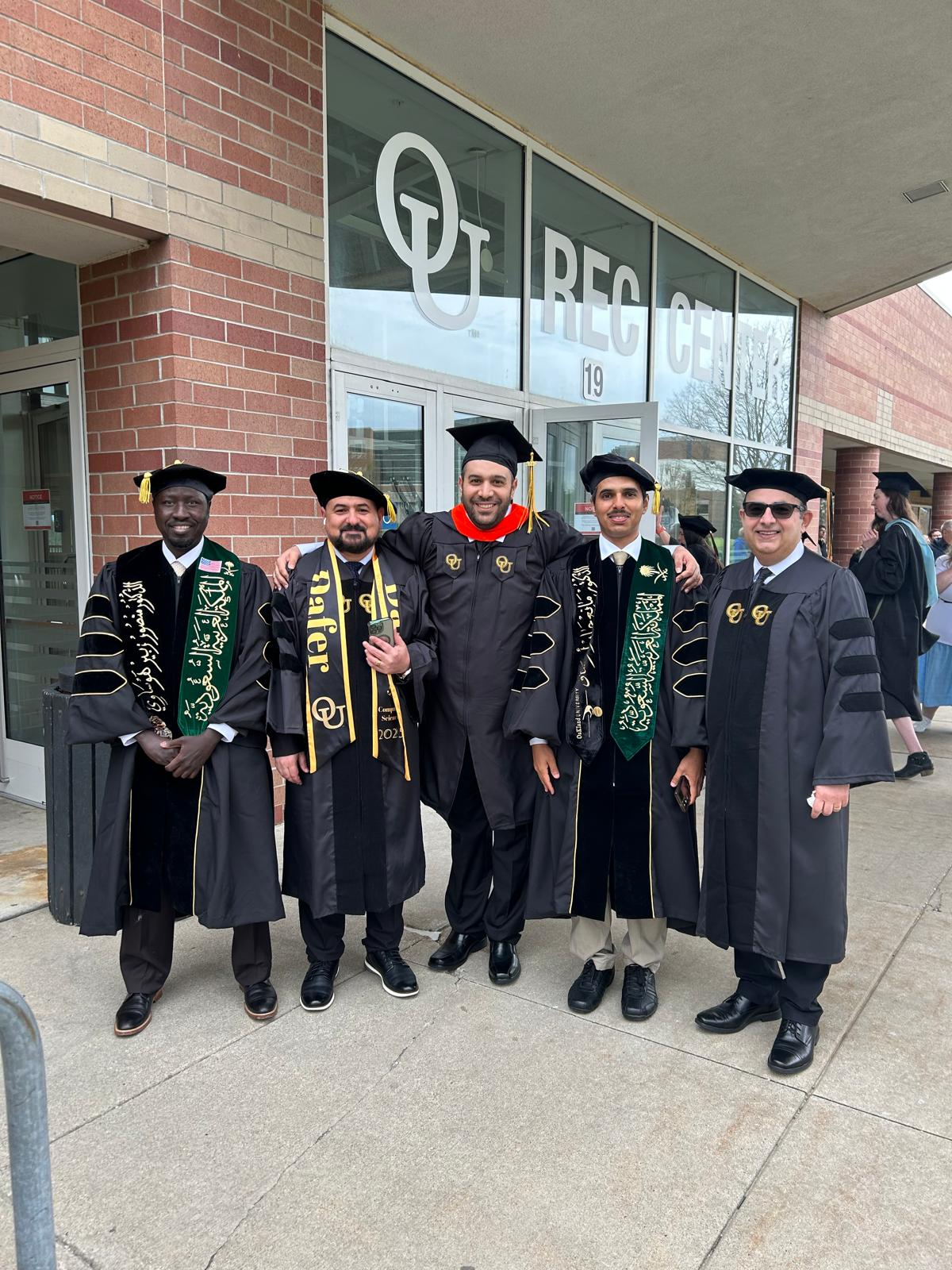 Dr. Mansour Hawsawi with fellow graduates at Oakland University